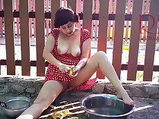 Retro maid prepares potatoes for dinner. Vintage performance.  Vintage maid have no panties. Masturbation outdoors. Potato